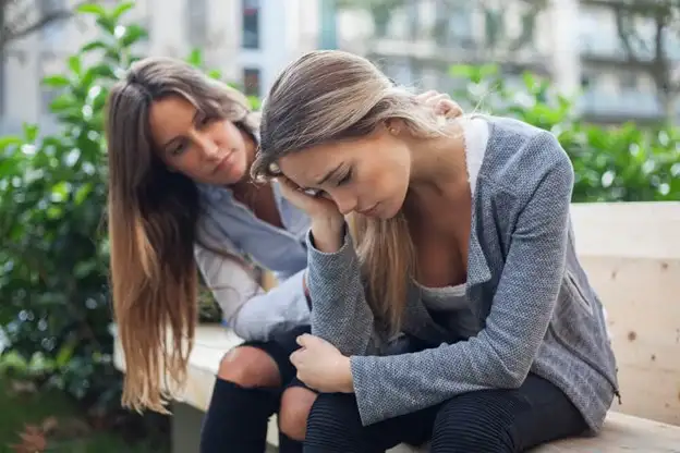 Girl consoling a friend