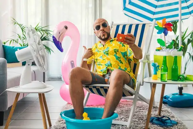 Man simulating a beach at home