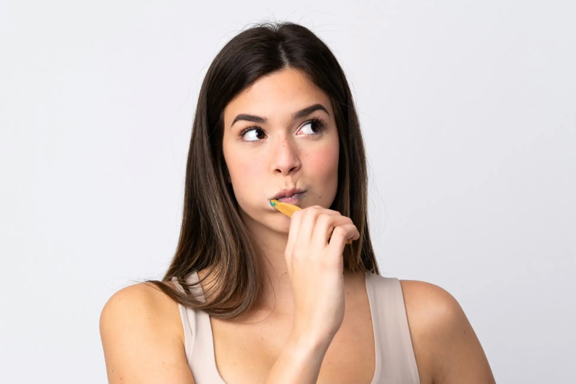 young woman with a toothbrush in her mouth