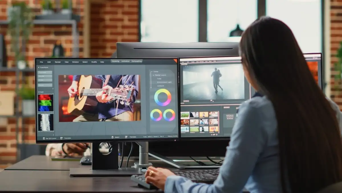 Woman sitting in front of computer editing