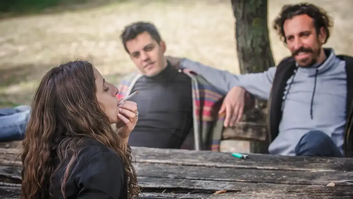 woman smoking with friends