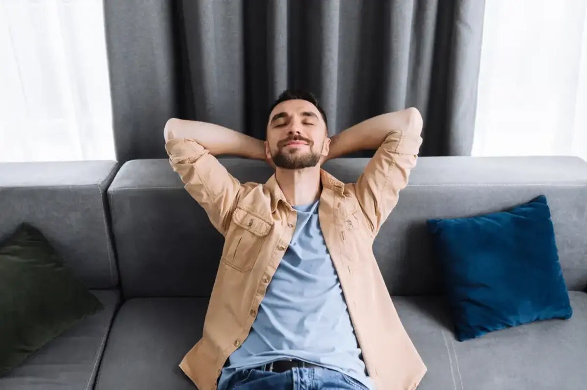 young man relaxing on a sofa