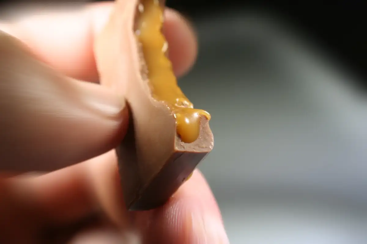 Caramel Chocolate In Hand Close Up