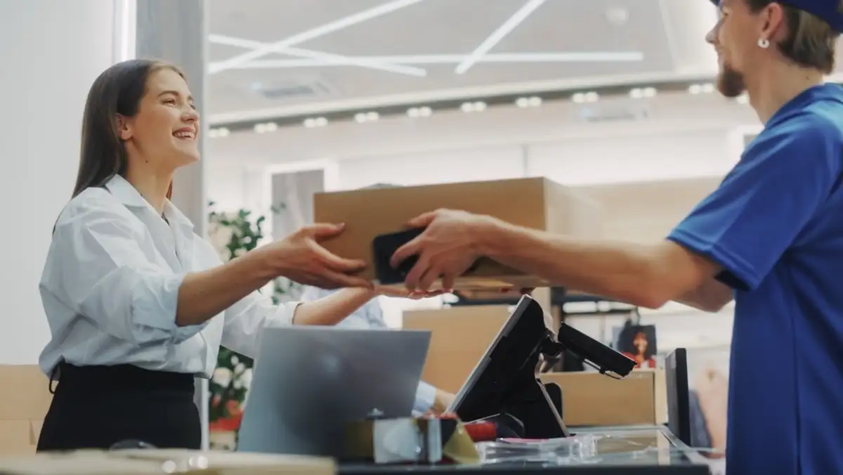 Man handling package to the woman