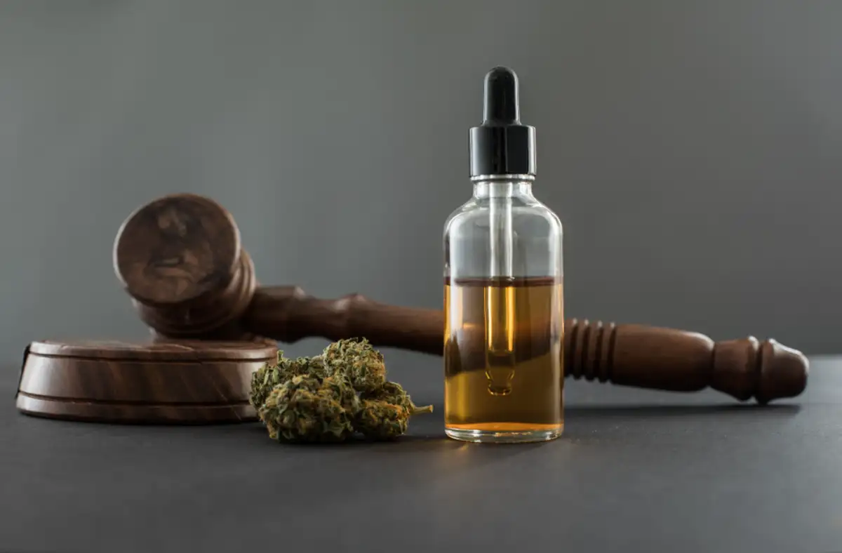 RSO Oil in a bottle and a gavel