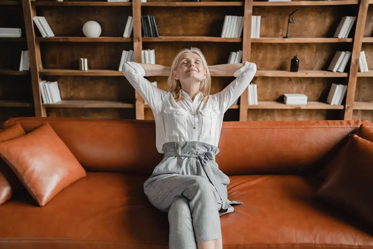 Woman relaxing on the sofa in office after hardwork