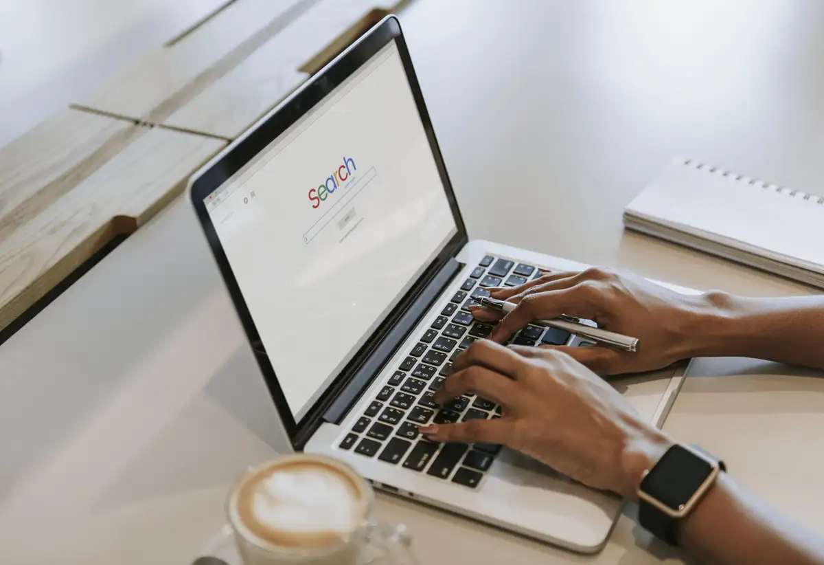 Woman searching on her laptop