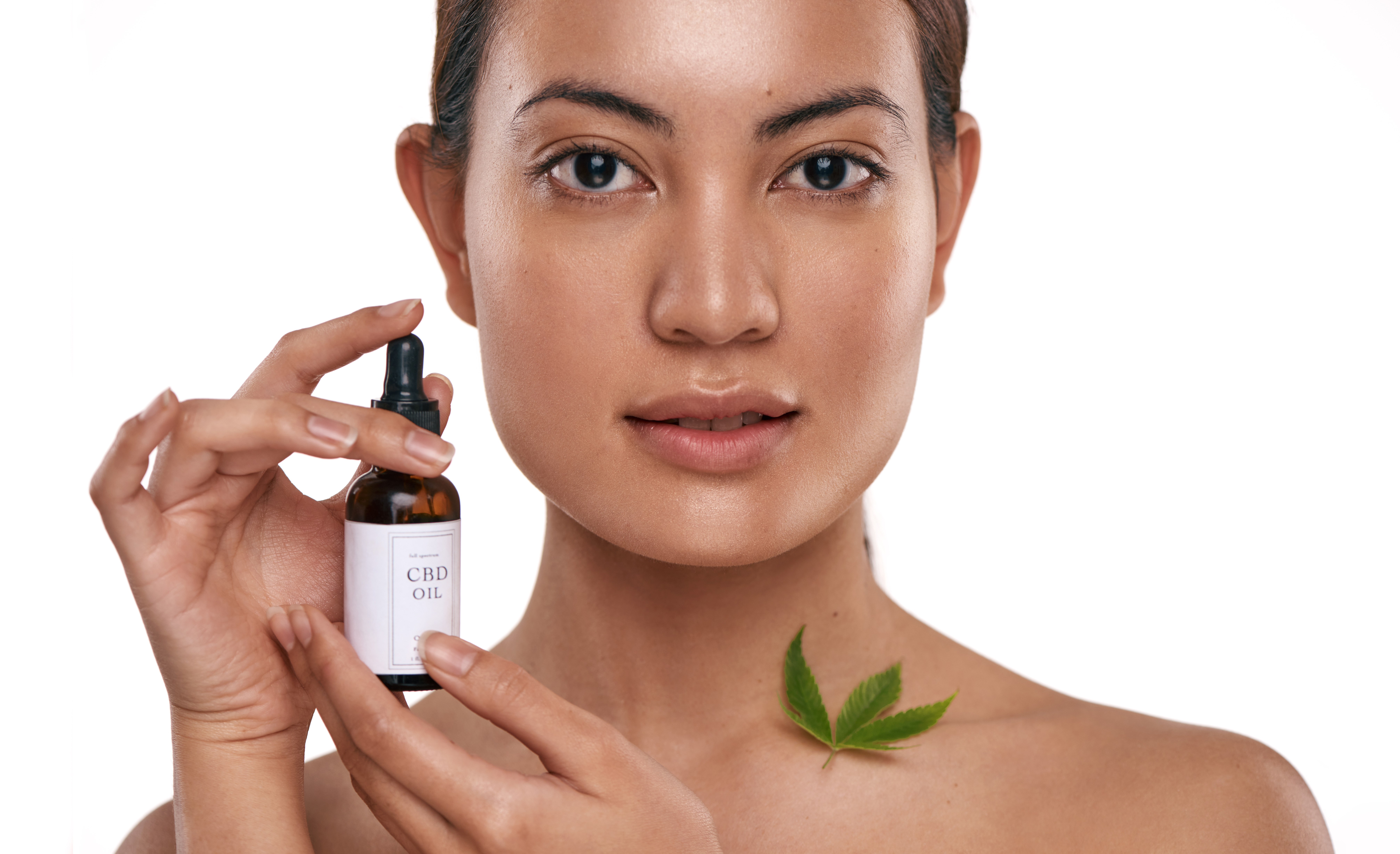 shot of a beautiful young woman holding a bottle o 2023 11 27 05 27 13 utc