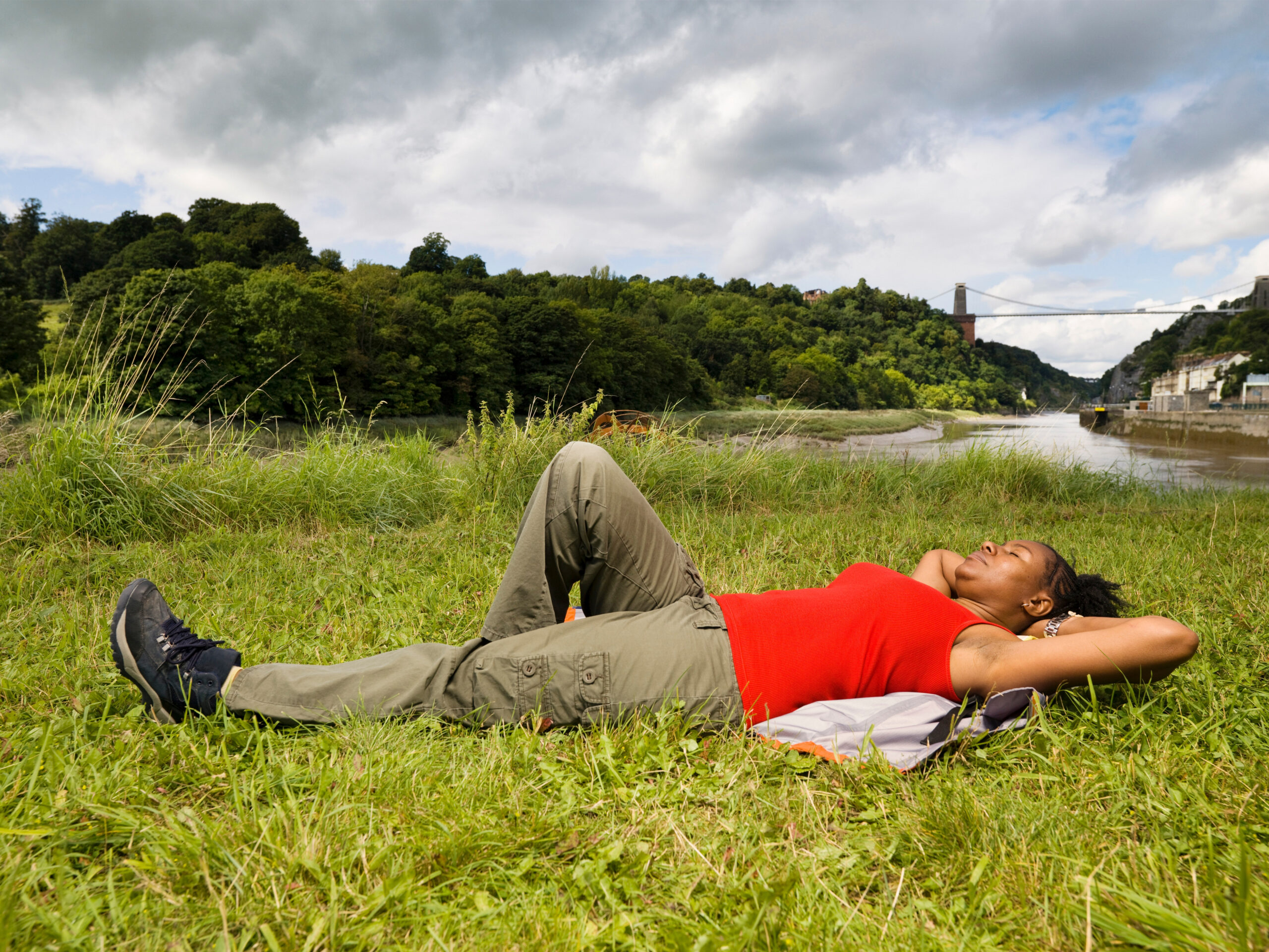 woman relaxing by river